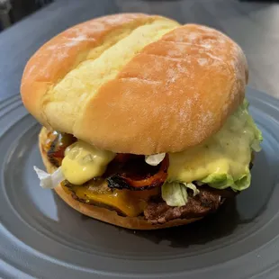 Bacado Burger - juicy bacon, avocado,  cheddar. Hub&apos;s fave.