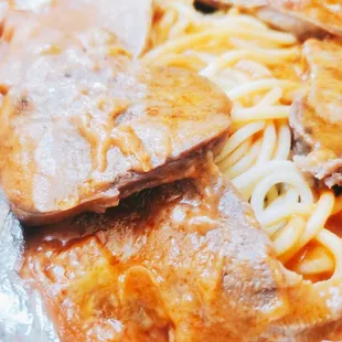 B13. Baked Ox Tongue in Tomato Sauce Over spaghetti