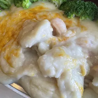 B12. Baked Seafood in Cream Sauce Over Rice