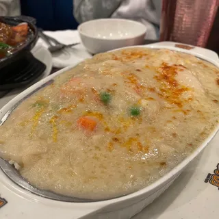 B16. Baked Fish in Cream Sauce Over Rice