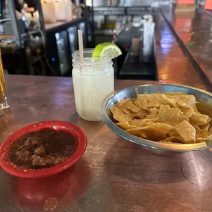 Chips and salsa with a margarita