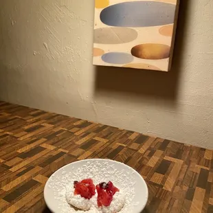 a plate of food on a wooden table