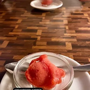 a bowl of strawberry sorbet on a plate