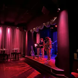 a band performing in a dimly lit room