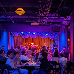 a group of people sitting at a restaurant
