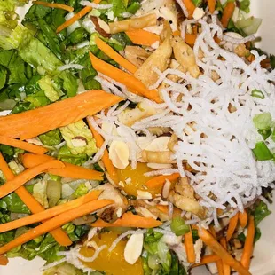 a salad in a styrofoam container