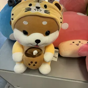 Shiba with boba and lion costume?