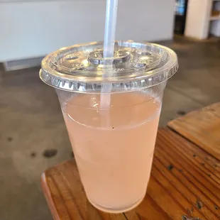 a plastic cup with a straw