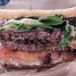 Cliff Burger with sauce and produce added