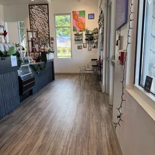 Bar sitting available indoors as well as art for sale.