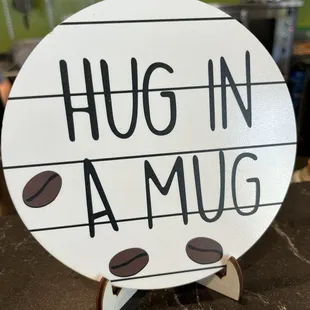 a hug in a mug sign