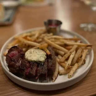 a plate of steak and french fries