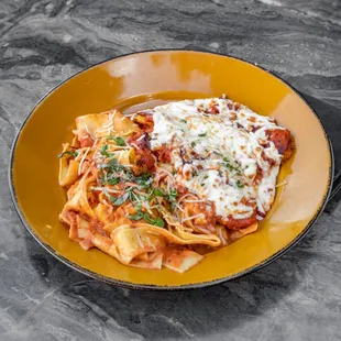 Chicken Parmesan with House made Marinara and Rigatoni