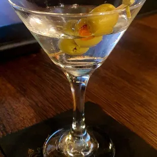 a martini with olives in it