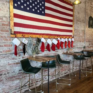 american flag hanging on brick wall