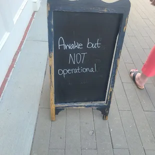 Before entering the coffee shop, you get a nice chuckle at the witty chalkboard sign.