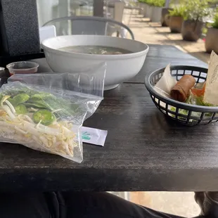 Pho egg roll and bag of veggies.