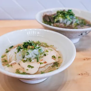 two bowls of soup on a table