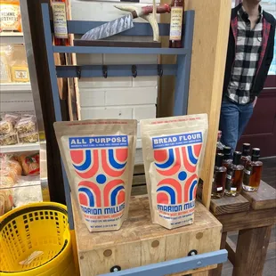 two bags of bread sitting on a shelf