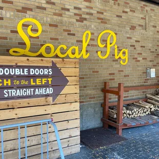 a sign in front of a brick building
