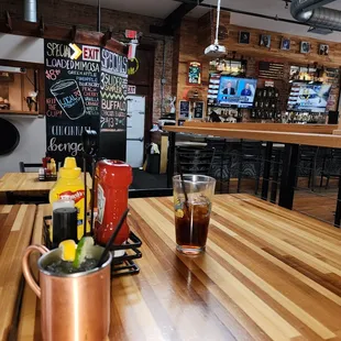 a table with drinks and a menu