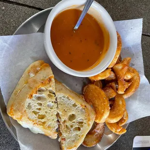 Buttery grilled cheese with tomato soup for dipping