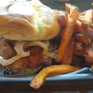 Mother clucker chicken sandwich with sweet potato fries.