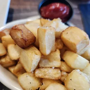 a plate of french fries and ketchup