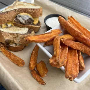 Patty melt sandwich with side of sweet potato fries