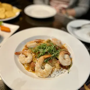 a plate of shrimp and rice