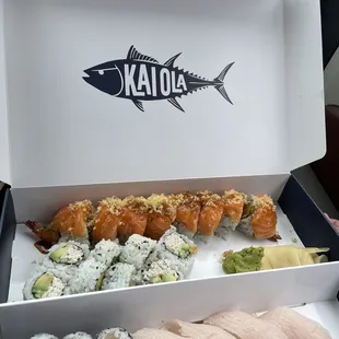 a box of sushi and rolls