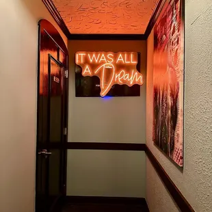 Bathroom-adjacent neon sign