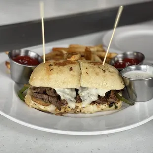 Beef Tenderloin Steak on Ciabatta with Hand-Cut Fries - Provolone, caramelized onion, mushroom, bell pepper, mayo