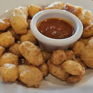 Half portion of the fried cheese curds. Really good marinara.