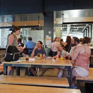 a group of people sitting at tables