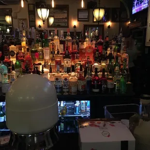 a bar with a variety of liquors
