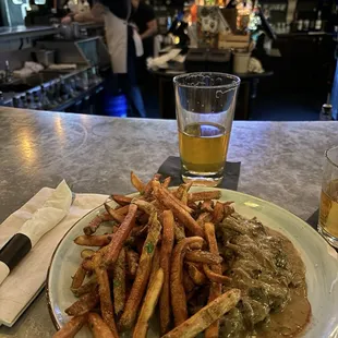 Steak Frites in a delicious mushroom sauce and their famous fries with the gravy your in Poutine Heaven