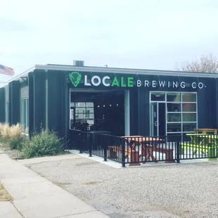 Summer taproom and patio with open overhead door at LocAle Brewing Company (Mankato, MN)