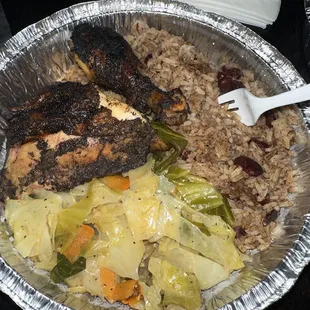 Jerk chicken, rice &amp; peas and cabbage.