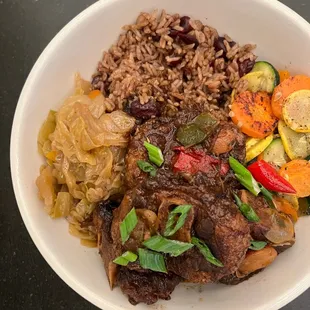 Oxtails, cabbage, rice and peas