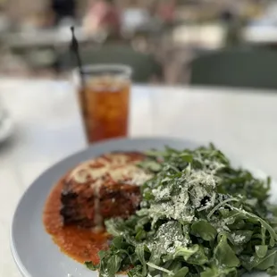 Eggplant parmigiana, salad greens, ice tea