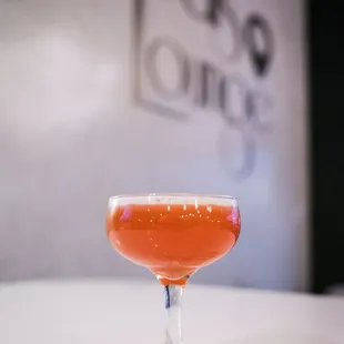 a drink in a glass on a table