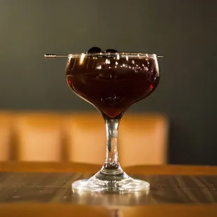 a glass of wine on a table