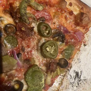 Cold "veggie" pizza with unwanted jalapeños