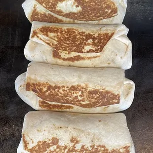 a stack of quesadillas on a grill