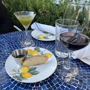 A glass of their house Chianti (Small pours here ), A special basil cocktail, and bread and oil and vinegar for dipping.