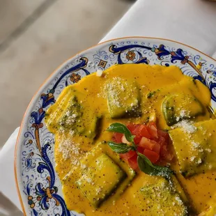 Ravioli D' Aragosta ( Squid Ink Ravioli Stuff w/ Lobster Meat in Creamy Saffron Sauce)