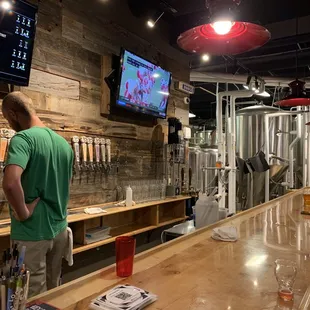 a man standing at a bar