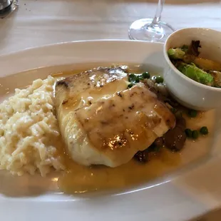 Sea Bass with lemon beurre blanc, mushroom risotto and Brussel sprouts