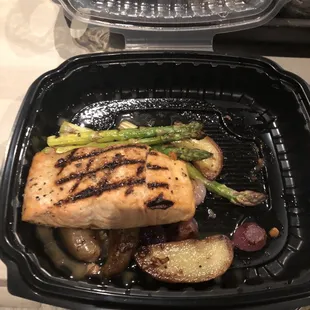 Carry out King salmon with roasted tomatoes and fingerlings and grilled asparagus.
